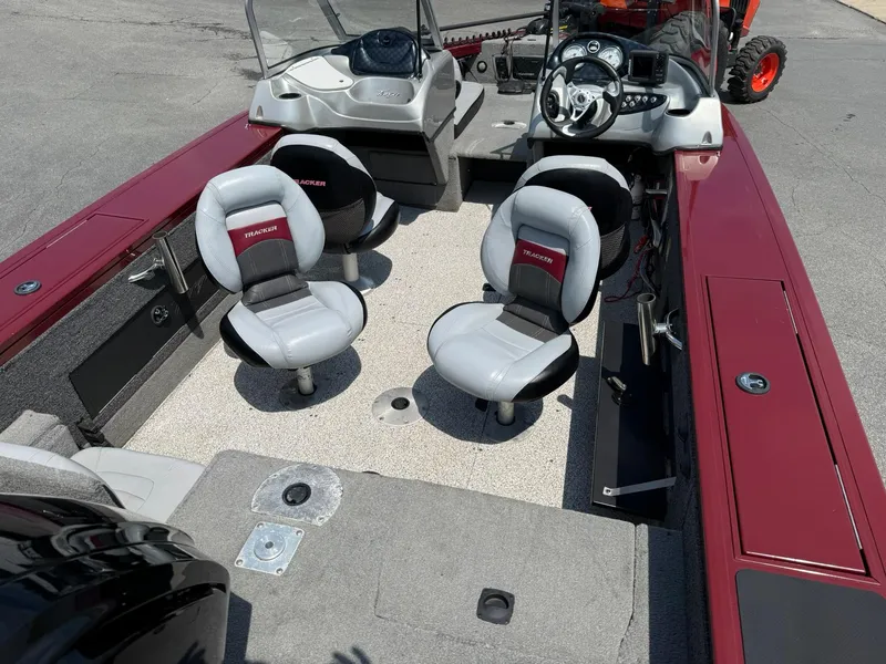 Slide: The Image of 2012 Tracker Targa V-18 Combo boat interior with seating and dashboard. - 8