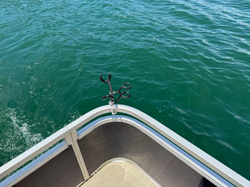 Slide: The Image of 2017 Silver Wave 230 Island CC boat on clear blue water. - 17