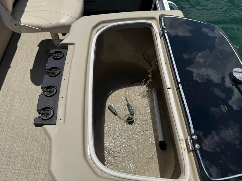 Slide: The Image of Open storage compartment on 2017 Silver Wave 230 Island CC boat with water inside. - 20