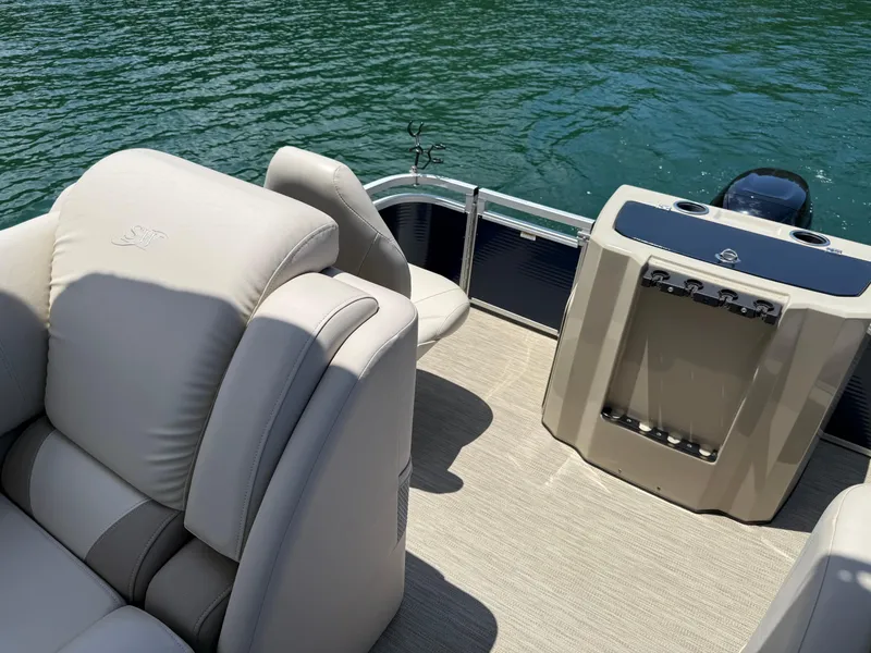 Slide: The Image of 2017 Silver Wave 230 Island CC boat interior with plush seating and water view. - 22