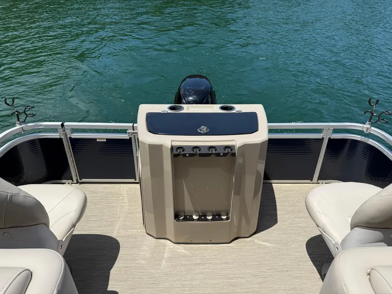 Slide: The Image of 2017 Silver Wave 230 Island CC boat interior with seating and water view. - 23