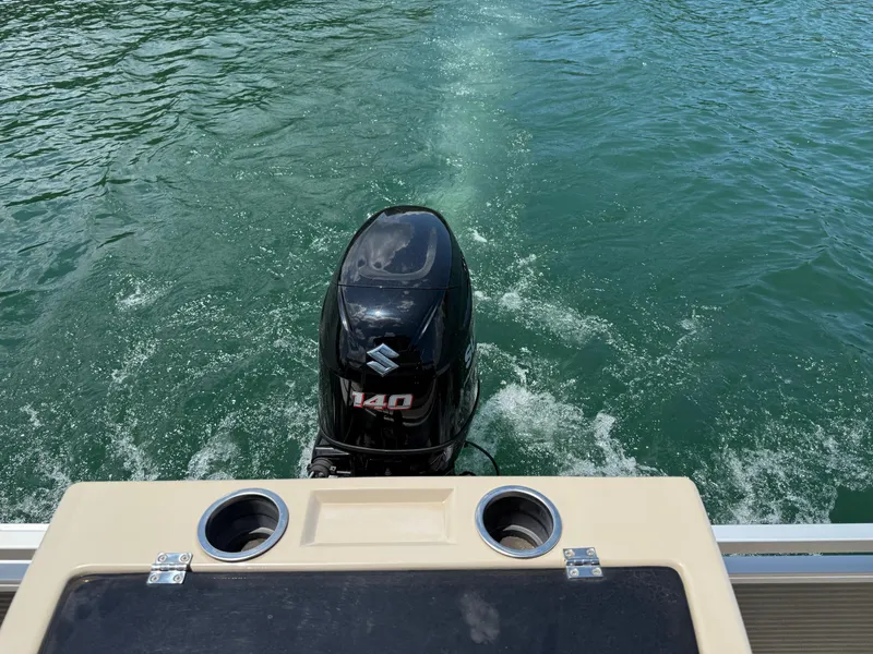 Slide: The Image of 2017 Silver Wave 230 Island CC boat with Suzuki 140 outboard motor on water. - 25