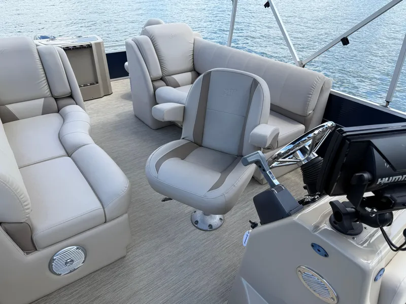 Slide: The Image of Interior of 2017 Silver Wave 230 Island CC boat with plush seating and steering console. - 28