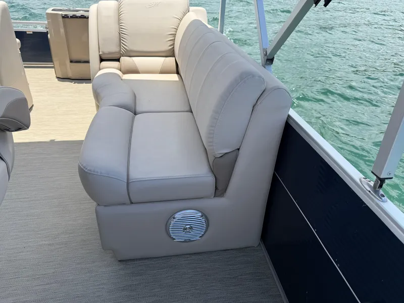 Slide: The Image of Luxurious seating on 2017 Silver Wave 230 Island CC boat, overlooking water. - 29