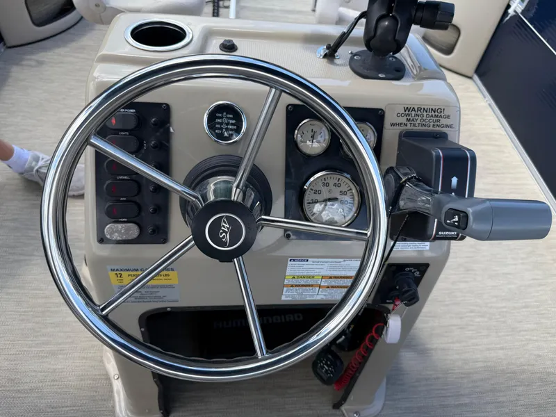 Slide: The Image of Steering console of 2017 Silver Wave 230 Island CC boat with gauges and controls. - 31