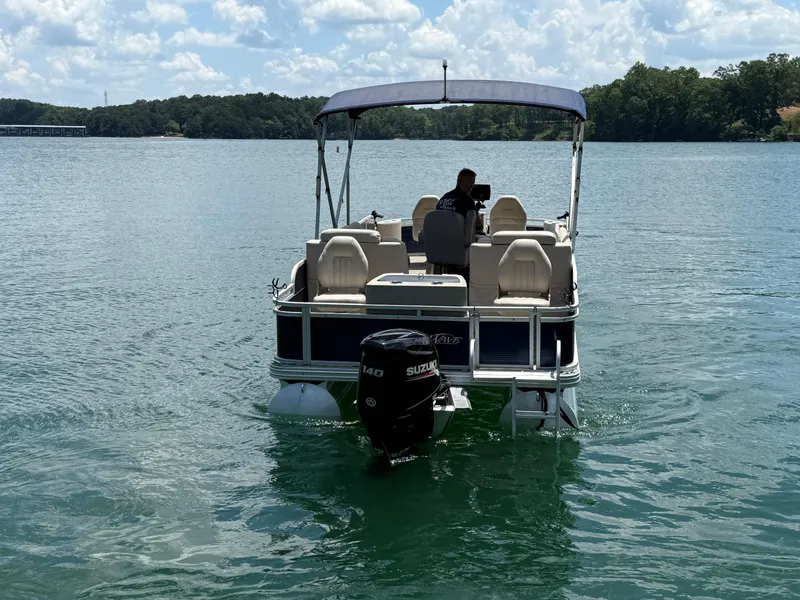 Slide: The Image of 2017 Silver Wave 230 Island CC boat on a lake, with Suzuki outboard motor. - 7