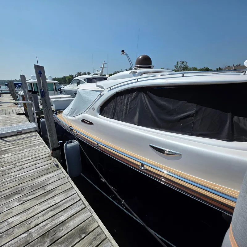 Slide: The Image of 2013 Zeelander Z44 yacht docked at marina under clear blue sky. - 13