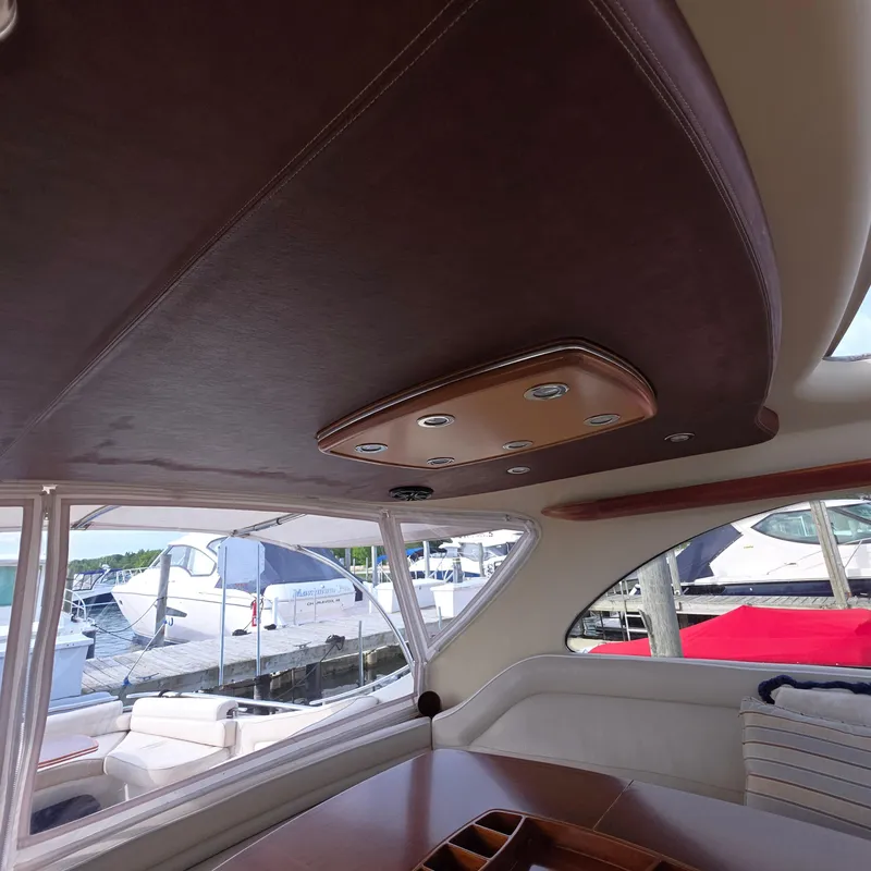 Slide: The Image of Interior of 2013 Zeelander Z44 yacht with elegant leather ceiling and dockside view. - 16