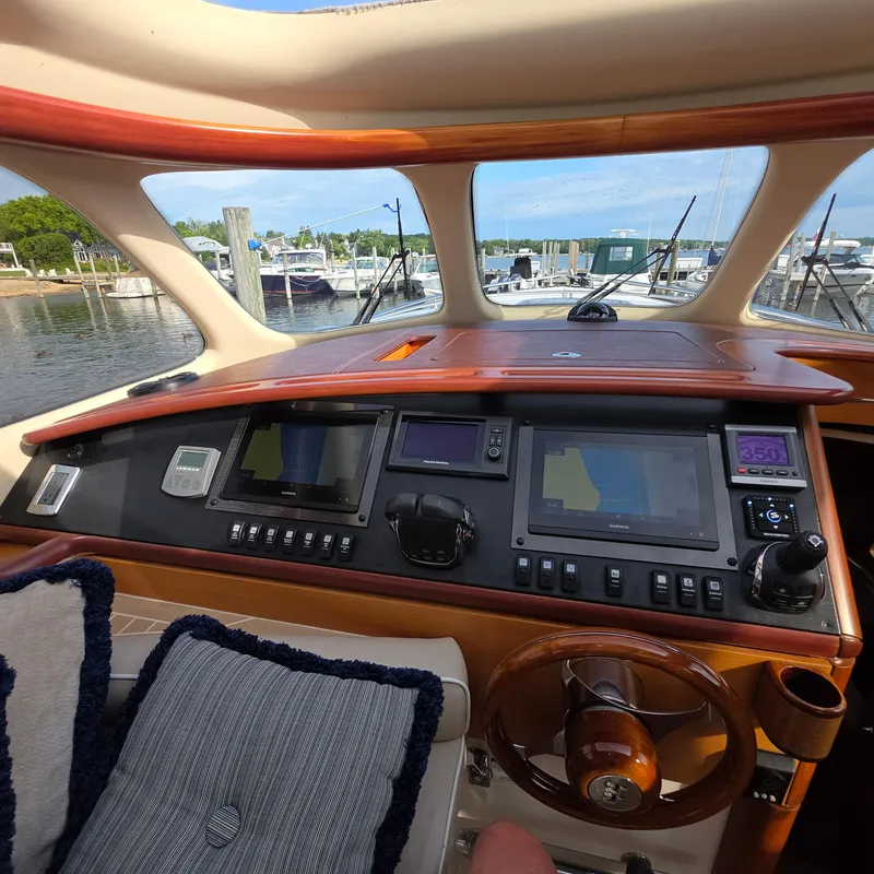 Slide: The Image of Interior view of 2013 Zeelander Z44 yacht cockpit with navigation equipment and wooden steering wheel. - 17