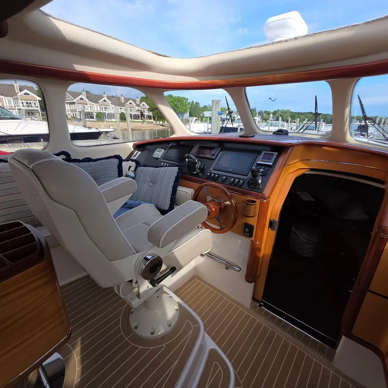 Slide: The Image of Interior of 2013 Zeelander Z44 yacht with luxurious helm and plush seating. - 21