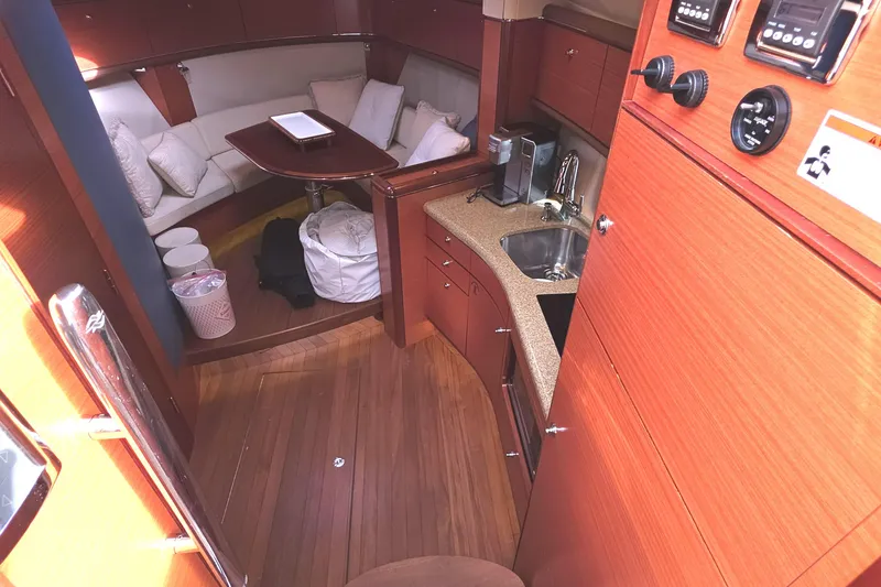 Slide: The Image of Luxurious interior of 2013 Zeelander Z44 yacht with wood finish and cozy seating area. - 26