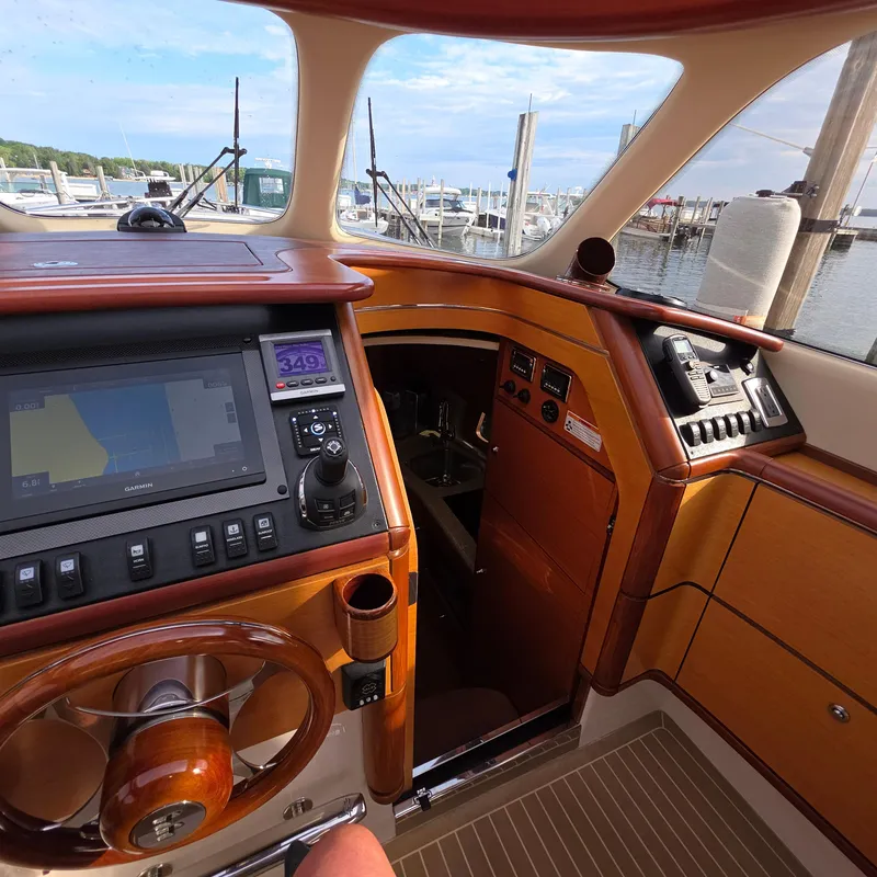 Slide: The Image of Interior of 2013 Zeelander Z44 yacht cockpit with navigation equipment and wooden finish. - 27