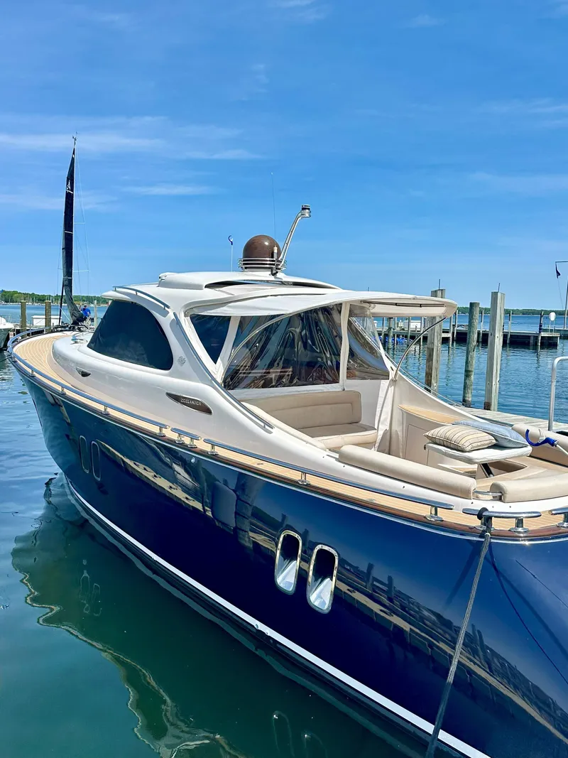 Slide: The Image of Luxurious 2013 Zeelander Z44 yacht docked in a serene marina setting. - 3