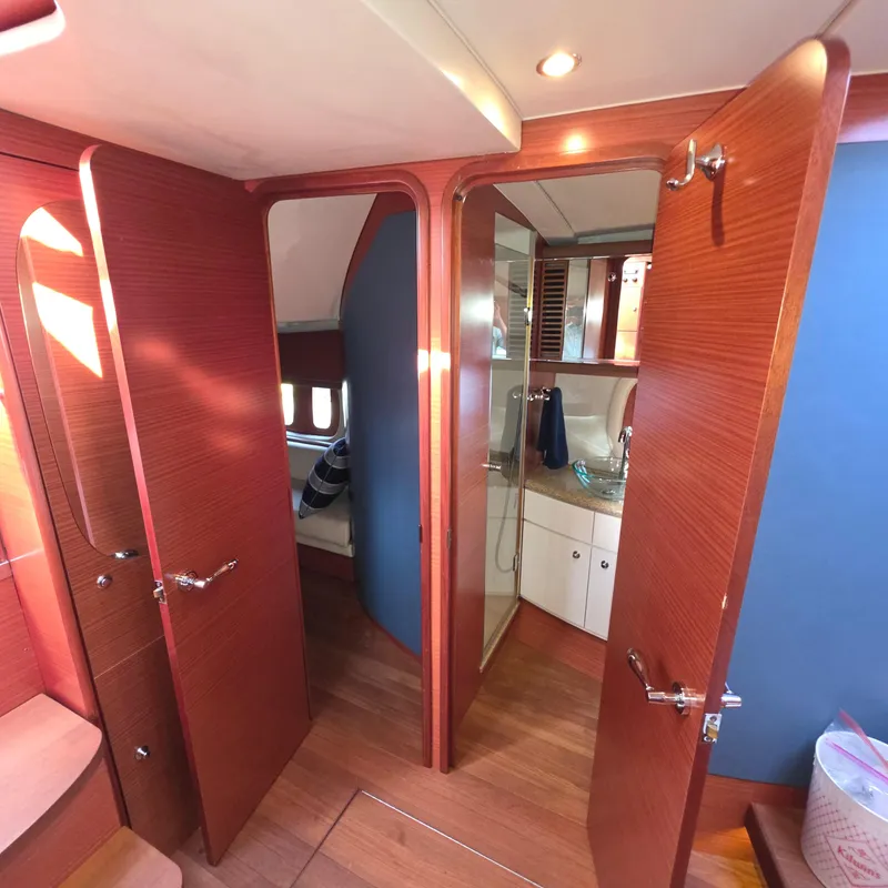 Slide: The Image of Interior of 2013 Zeelander Z44 yacht, featuring wooden doors and modern bathroom amenities. - 31