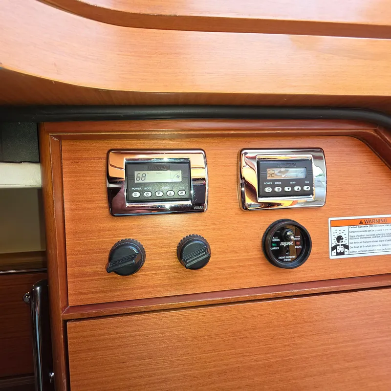 Slide: The Image of Control panel of a 2013 Zeelander Z44 yacht with digital displays and knobs. - 32