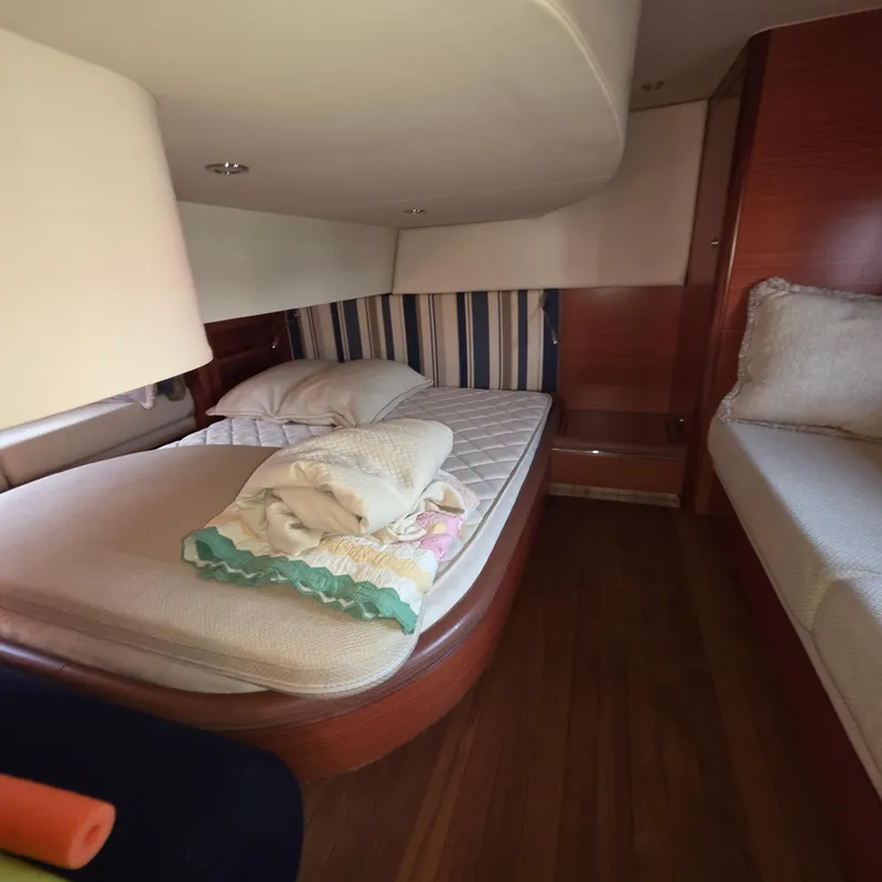 Slide: The Image of Cozy cabin interior of 2013 Zeelander Z44 yacht with bed and wooden accents. - 35