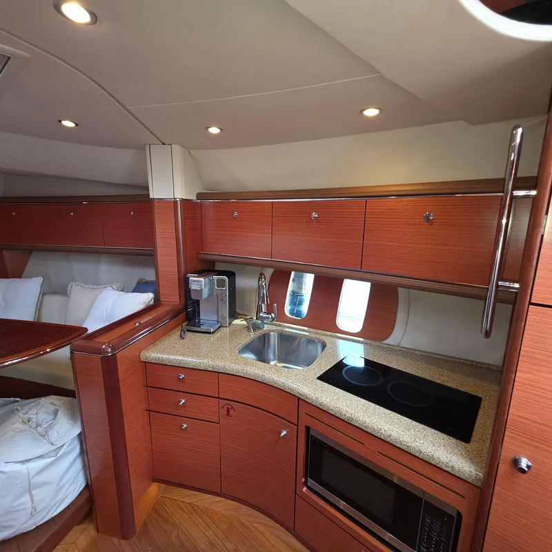 Slide: The Image of Luxurious 2013 Zeelander Z44 yacht interior with modern kitchen and elegant wood finish. - 36