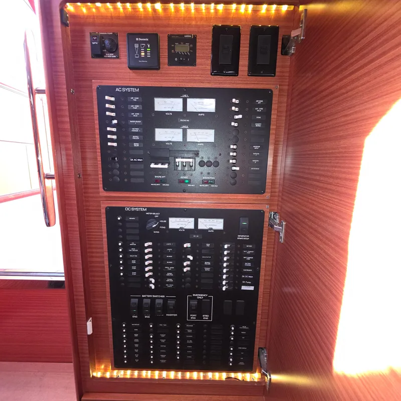 Slide: The Image of Electrical control panel on a 2013 Zeelander Z44 yacht, featuring AC and DC systems. - 37