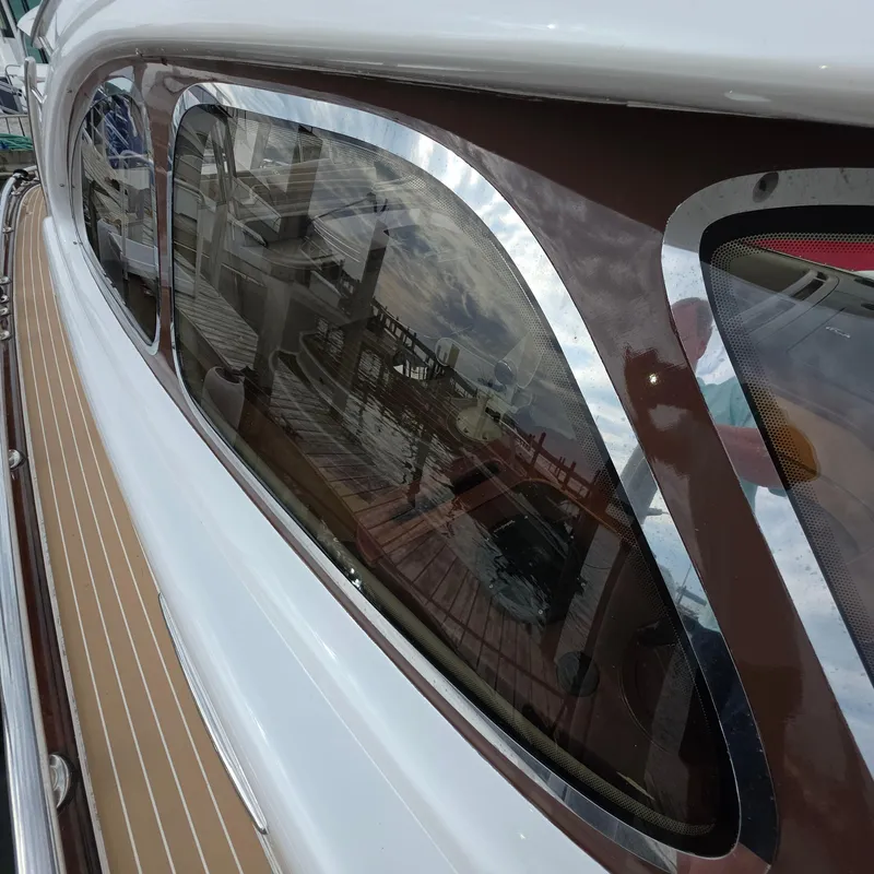 Slide: The Image of Close-up of 2013 Zeelander Z44 yacht window with dock reflection. - 48