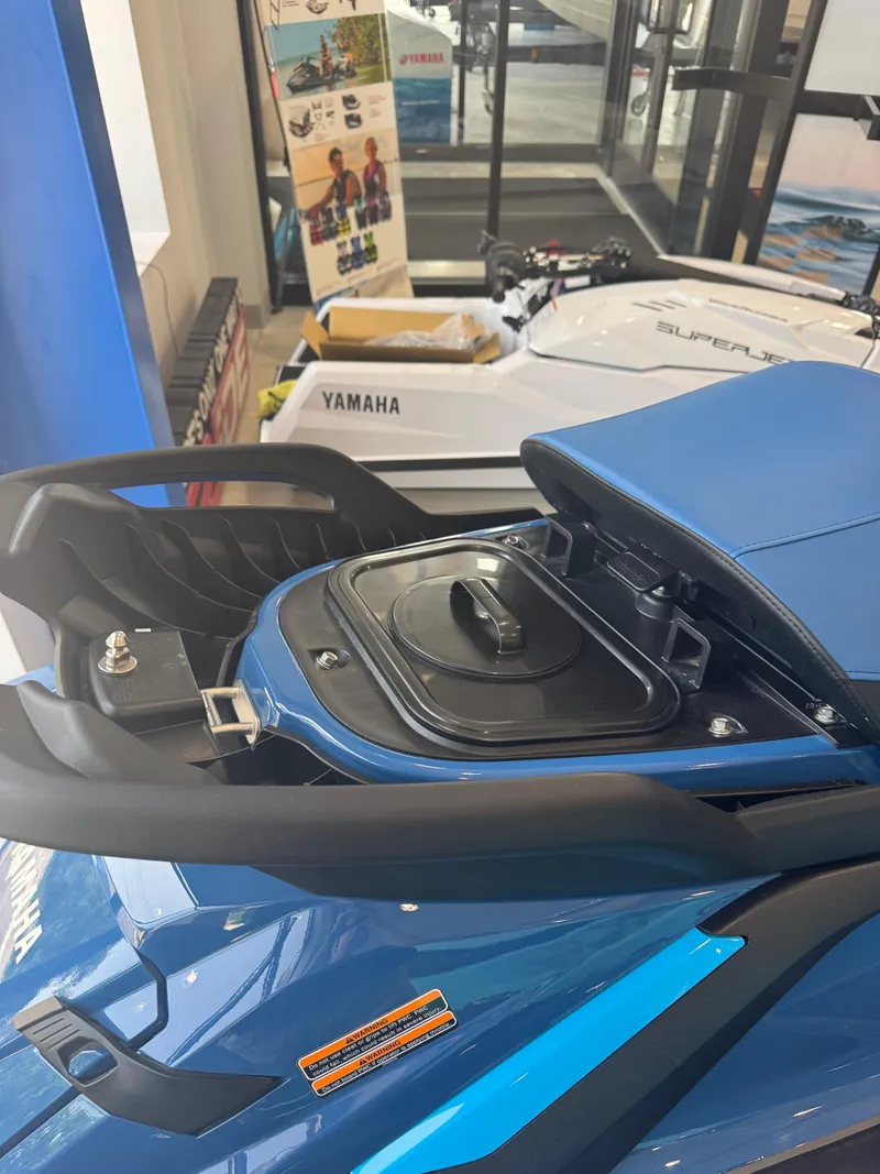 Slide: The Image of 2025 Yamaha WaveRunner FX Limited SVHO with open storage compartment in showroom. - 7