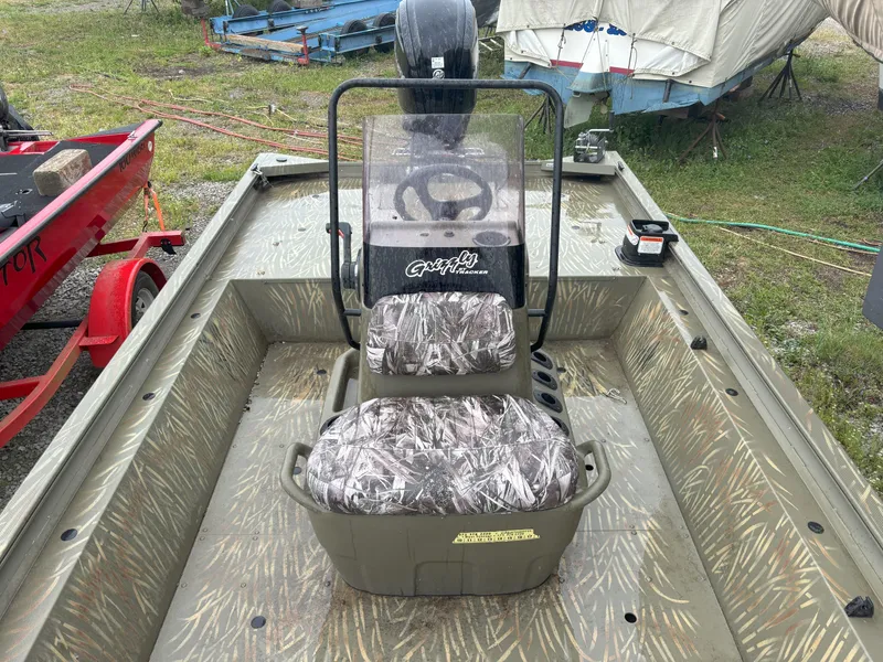 Slide: The Image of 2022 Tracker Grizzly 1860 CC boat with camo seats and steering console. - 10