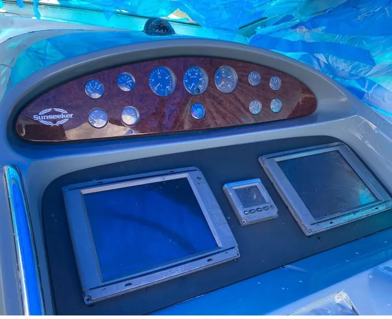 Slide: The Image of Control panel of a 2003 Sunseeker Portofino 46 yacht with gauges and screens. - 25