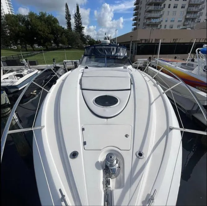 Slide: The Image of 2003 Sunseeker Portofino 46 yacht docked, showcasing sleek design and spacious deck. - 27