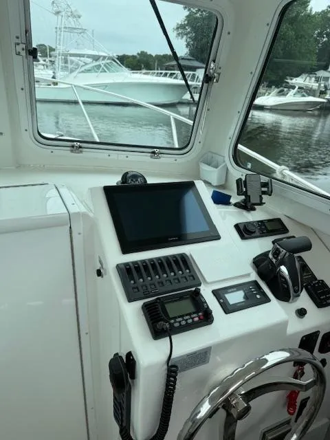 Slide: The Image of 2021 Steiger Craft 255 DV MIAMI boat cockpit with modern navigation equipment. - 11