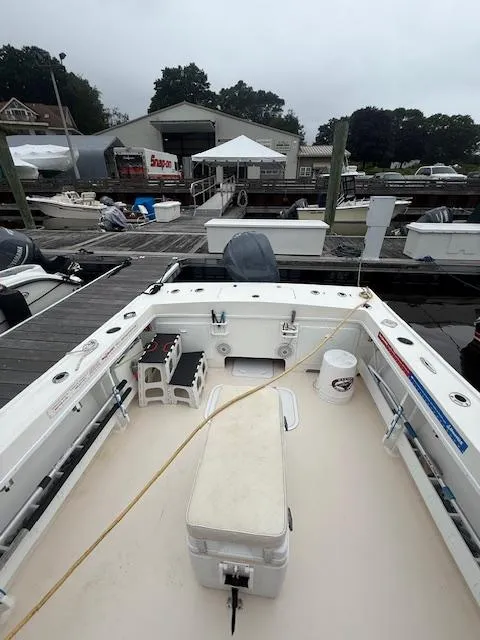 Slide: The Image of 2021 Steiger Craft 255 DV MIAMI boat docked at marina, featuring spacious deck and fishing equipment. - 6