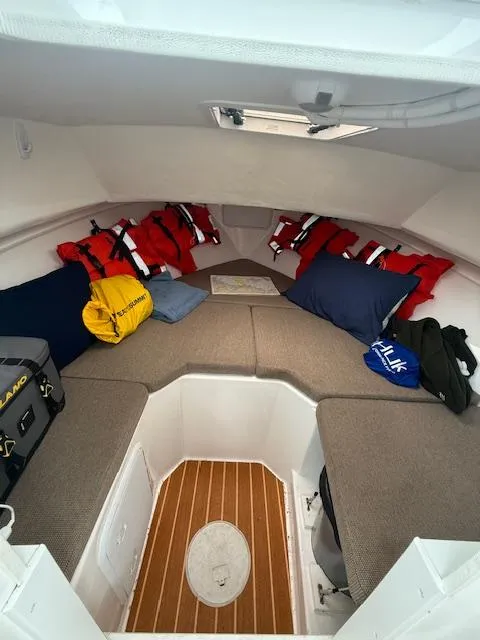 Slide: The Image of 2021 Steiger Craft 255 DV MIAMI cabin interior with life jackets and cushions. - 9