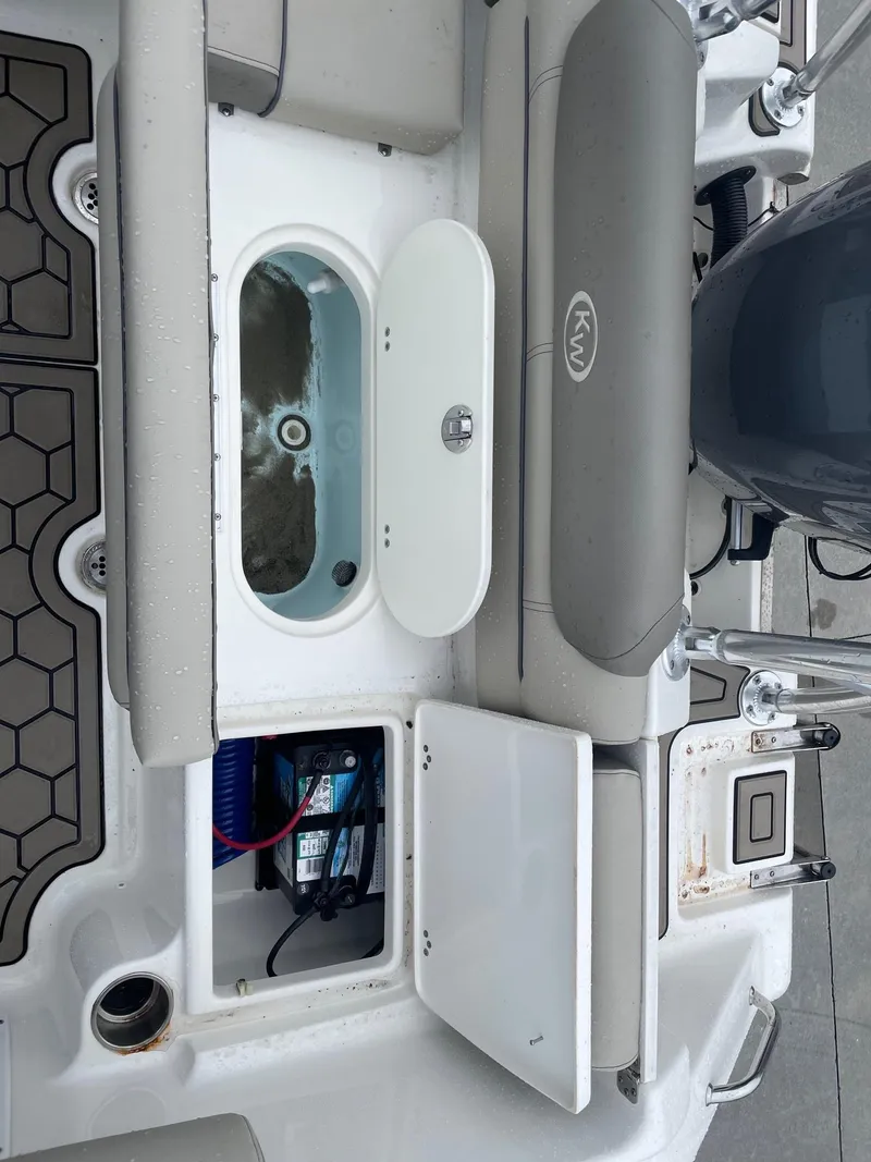 Slide: The Image of 2021 Key West 203 DFS boat interior with open compartments and seating. - 11