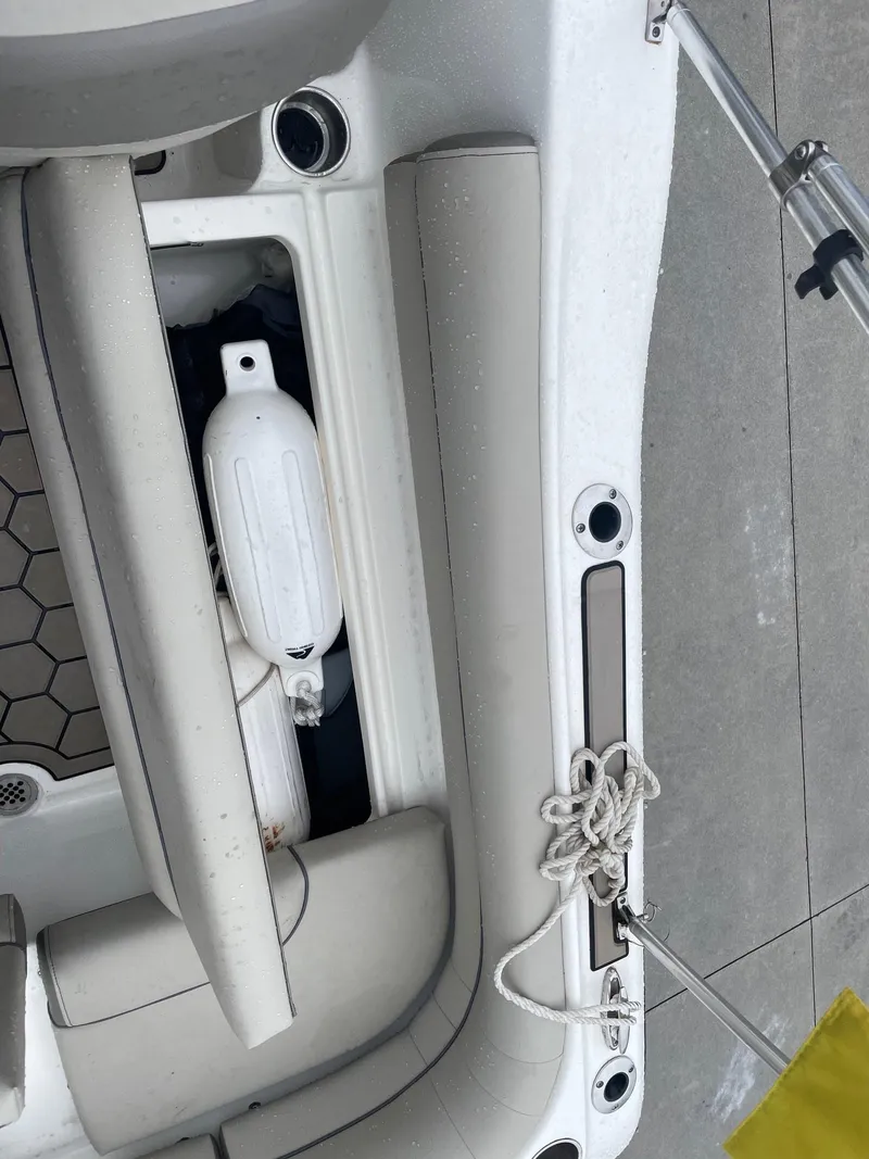 Slide: The Image of Interior view of a 2021 Key West 203 DFS boat with seating and storage. - 12