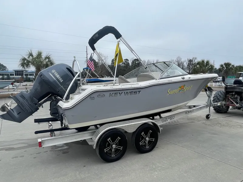 Slide: The Image of 2021 Key West 203 DFS boat on trailer with Yamaha outboard motor. - 2