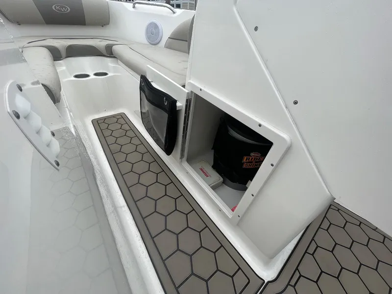 Slide: The Image of Interior of 2021 Key West 203 DFS boat showing storage compartment and seating area. - 9