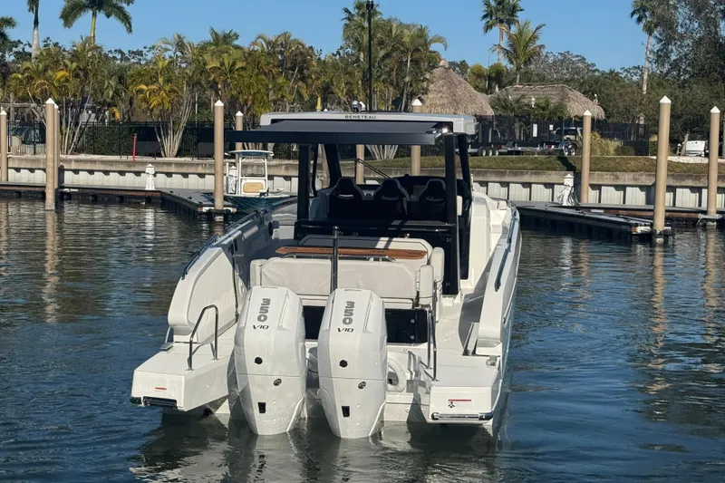 Slide: The Image of 2026 Beneteau Gran Turismo 35 yacht docked, featuring dual outboard engines. - 12