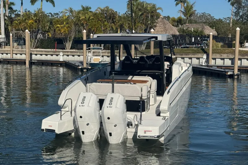 Slide: The Image of 2026 Beneteau Gran Turismo 35 yacht docked, featuring dual outboard engines. - 13