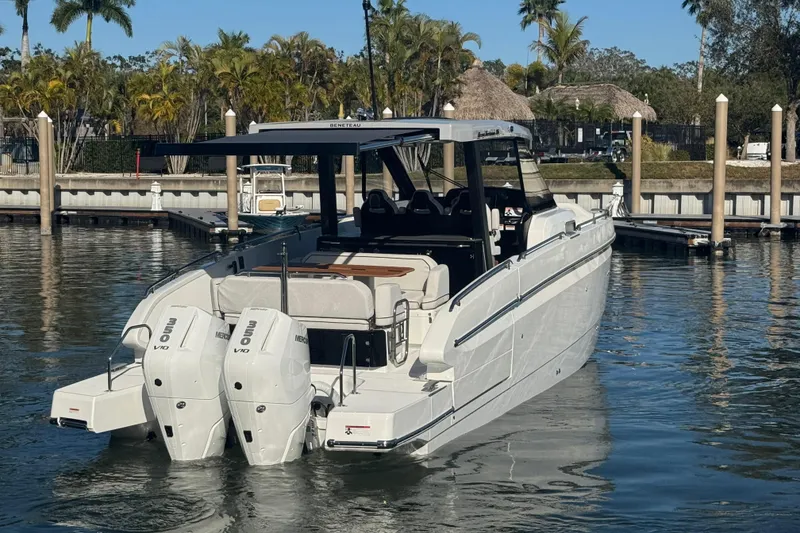 Slide: The Image of 2026 Beneteau Gran Turismo 35 yacht docked, featuring dual outboard engines. - 14