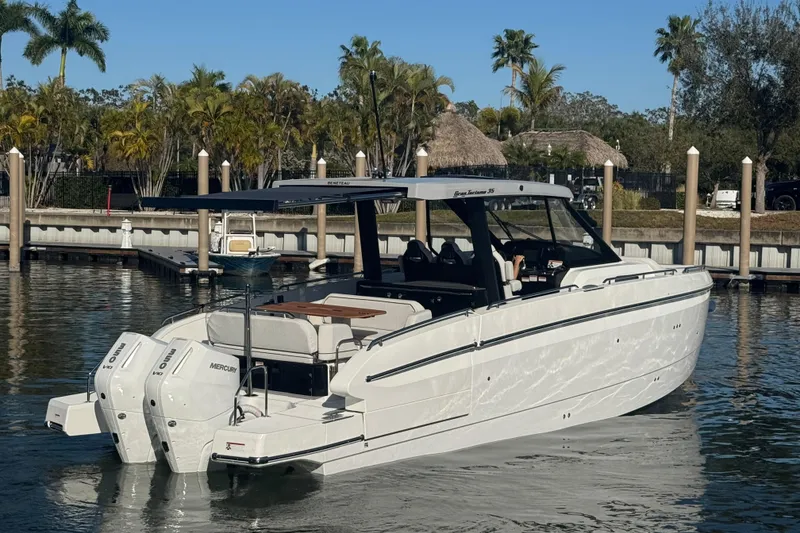 Slide: The Image of 2026 Beneteau Gran Turismo 35 yacht docked in a sunny marina setting. - 17