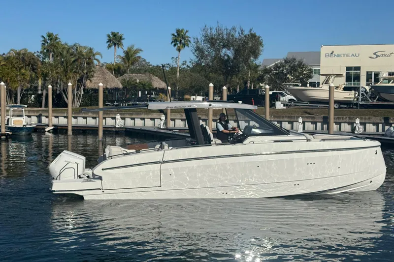 Slide: The Image of 2026 Beneteau Gran Turismo 35 yacht docked in a sunny marina setting. - 20