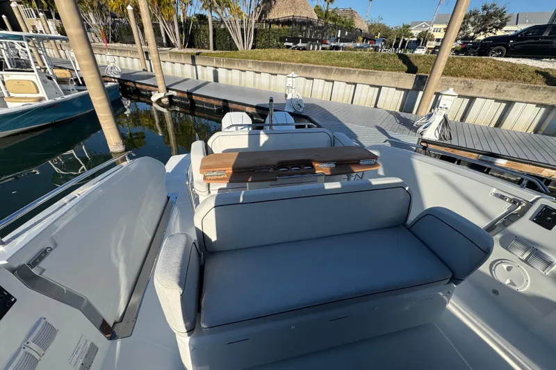 Slide: The Image of 2026 Beneteau Gran Turismo 35 boat interior with seating and dock view. - 29