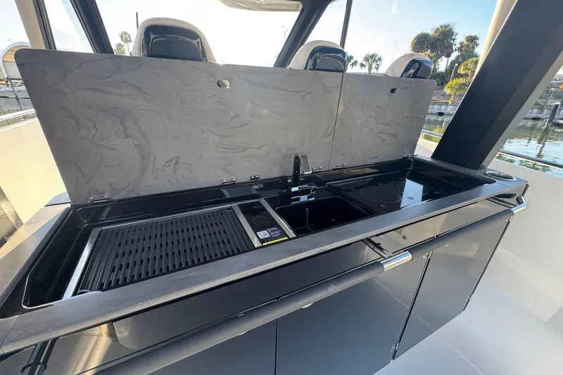 Slide: The Image of Outdoor kitchen on 2026 Beneteau Gran Turismo 35 yacht with grill and sink. - 30