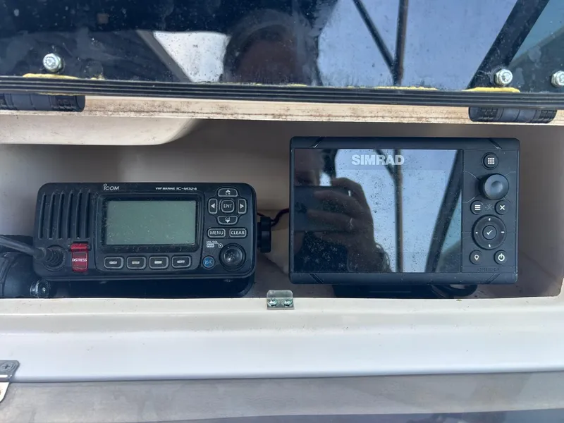 Slide: The Image of VHF marine radio and Simrad display on a 1999 Grady-White 192 Tournament boat. - 10