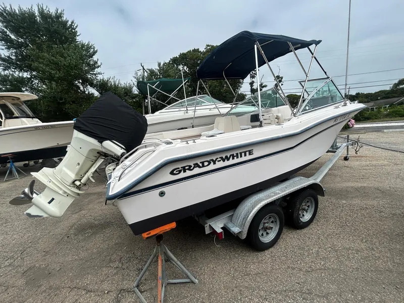 Slide: The Image of 1999 Grady-White 192 Tournament boat on trailer, parked outdoors. - 2