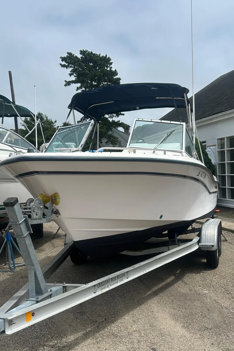 Slide: The Image of 1999 Grady-White 192 Tournament boat on trailer, parked outdoors. - 3