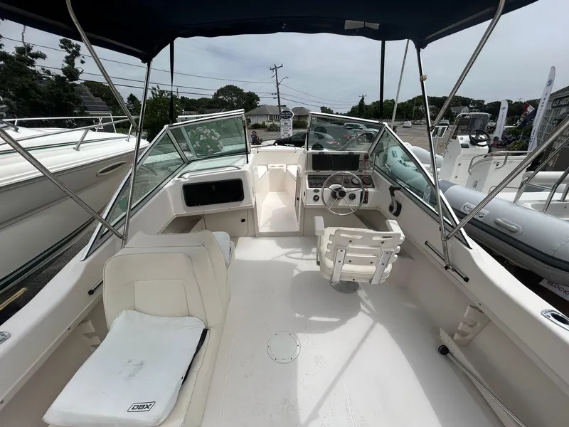 Slide: The Image of 1999 Grady-White 192 Tournament boat interior with steering wheel and seating. - 4