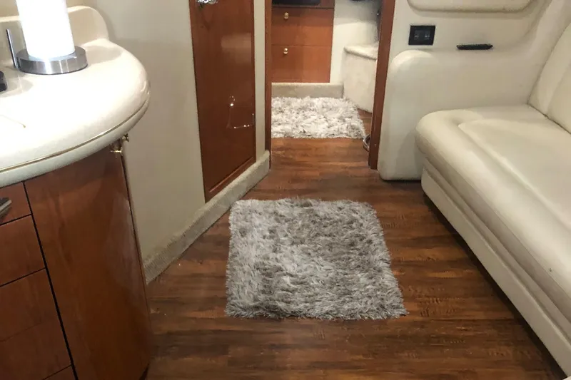 Slide: The Image of Interior of a 1999 Sea Ray 460 Sundancer yacht, featuring luxurious seating and modern design. - 11