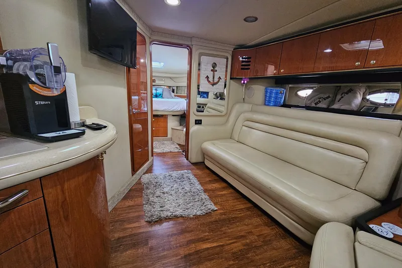 Slide: The Image of Luxurious interior of 1999 Sea Ray 460 Sundancer yacht with leather seating and modern amenities. - 26