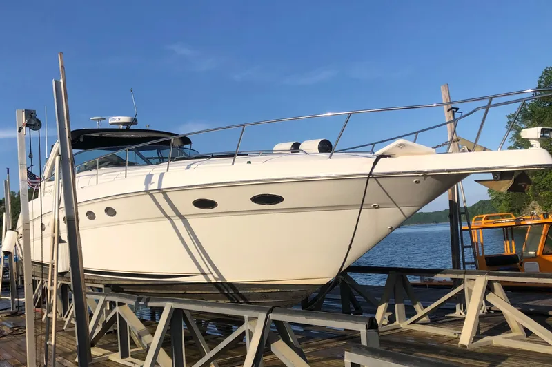 Slide: The Image of 1999 Sea Ray 460 Sundancer docked at Port of Lawrenceburg, KY, rear view. - 4