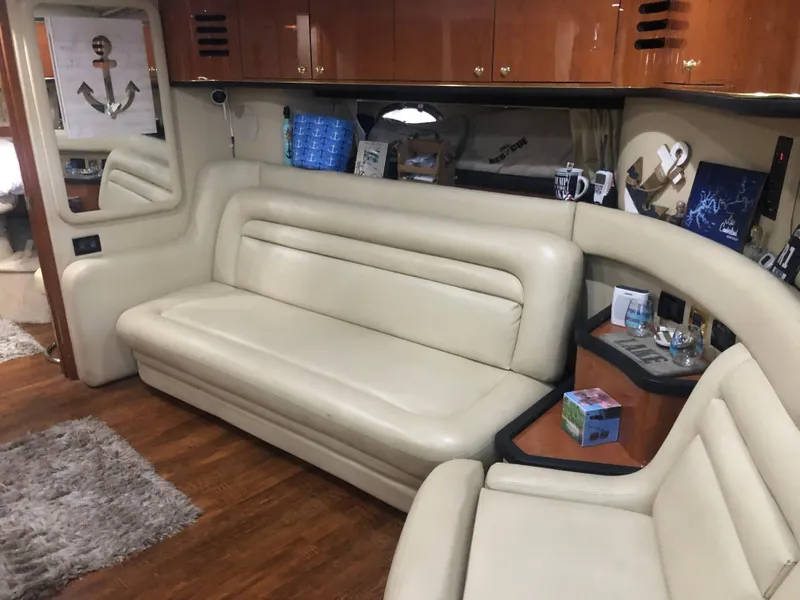 Slide: The Image of 1999 Sea Ray 460 Sundancer docked in a covered marina. - 6