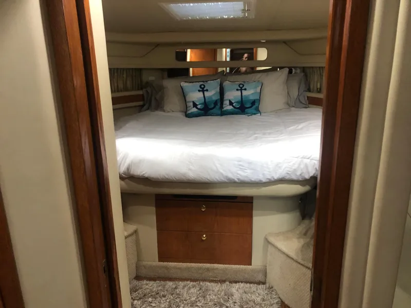 Slide: The Image of Interior of a 1999 Sea Ray 460 Sundancer yacht with elegant seating and table. - 8